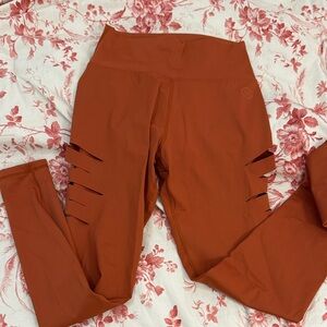 Virus Women's Leggings in Rust Orange